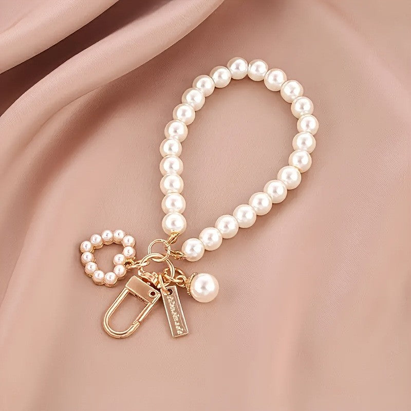 The ‘Pearl Bow Heart Bag Charm’